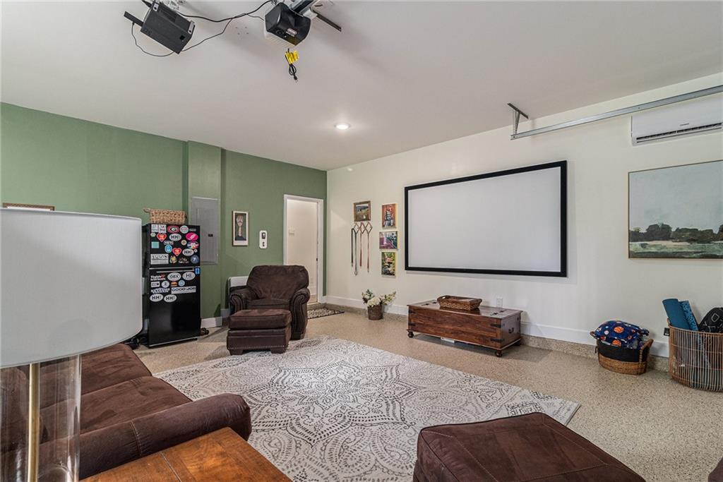 1229 Dean Hill Road Southeast Monroe, GA 30655 - Photo 24 of 51 a living room with furniture and a flat screen tv