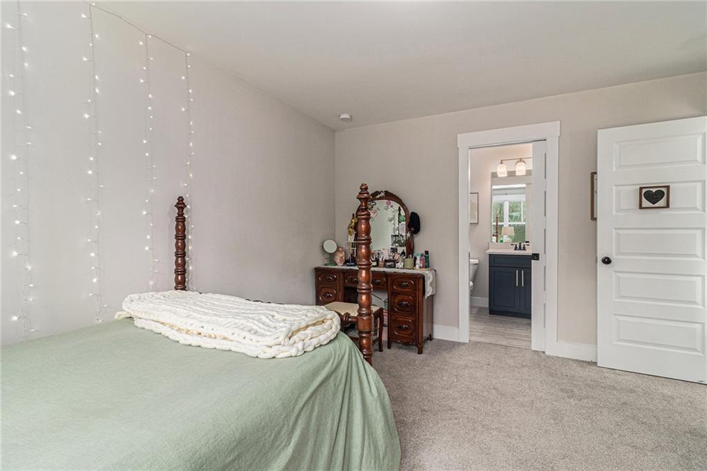 1229 Dean Hill Road Southeast Monroe, GA 30655 - Photo 26 of 51 a bed room with a bed and furniture