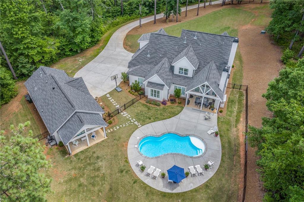 1229 Dean Hill Road Southeast Monroe, GA 30655 - Photo 50 of 51 an aerial view of a house with outdoor space and pool