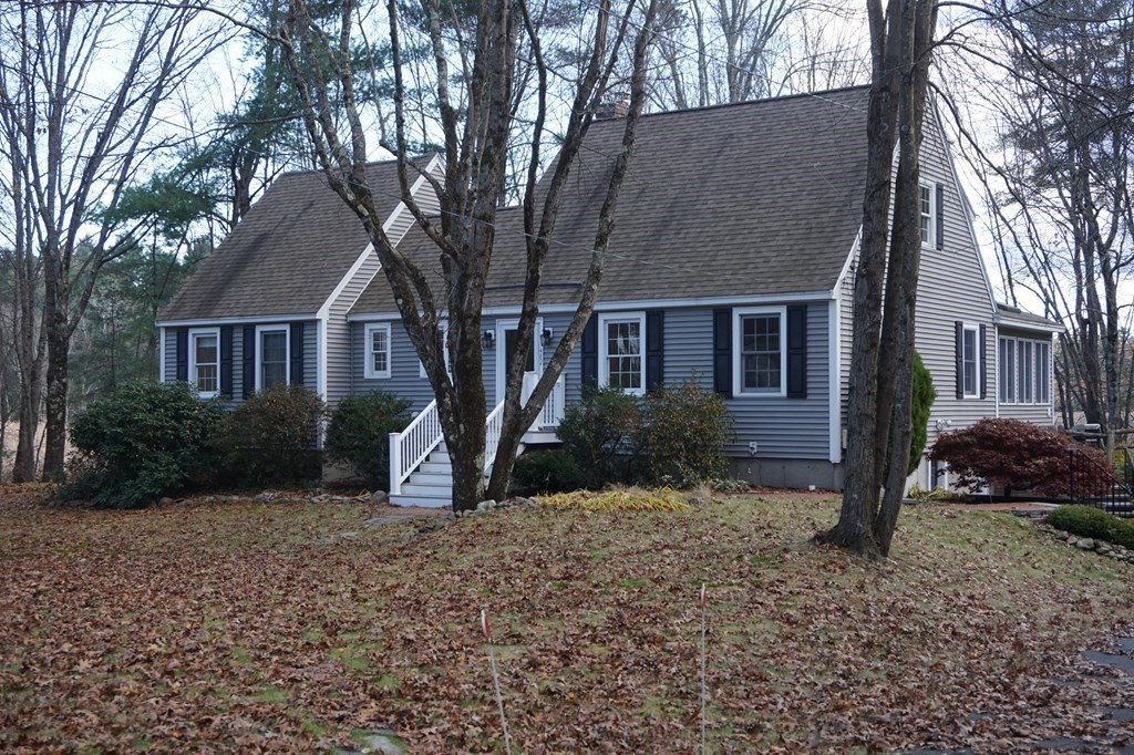 462 Lowell Road Groton, MA 01450 - Photo 1 of 42 a front view of a house with a yard
