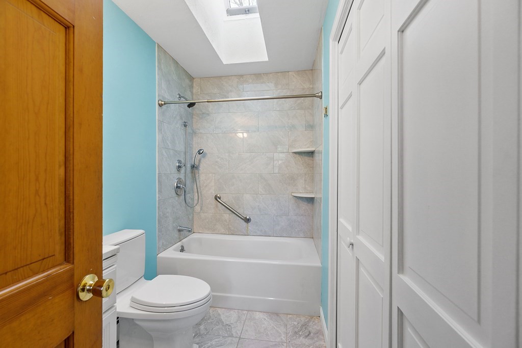 462 Lowell Road Groton, MA 01450 - Photo 17 of 42 a bathroom with a bathtub and a shower