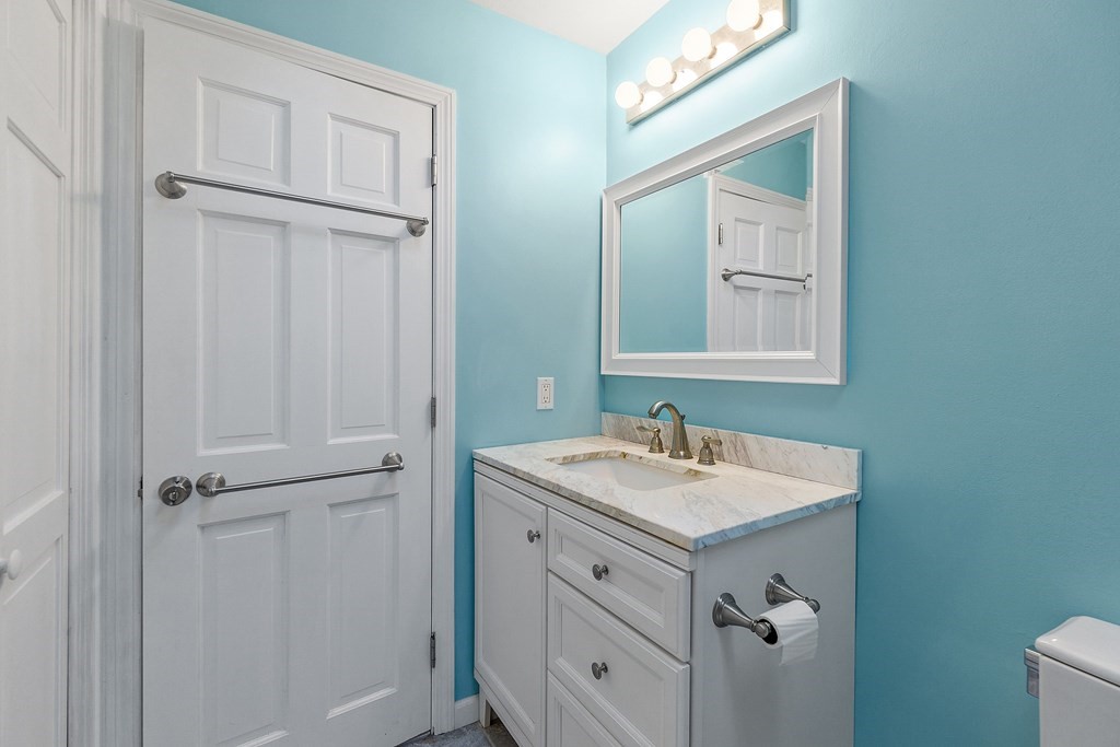 462 Lowell Road Groton, MA 01450 - Photo 18 of 42 a bathroom with a sink vanity and a mirror