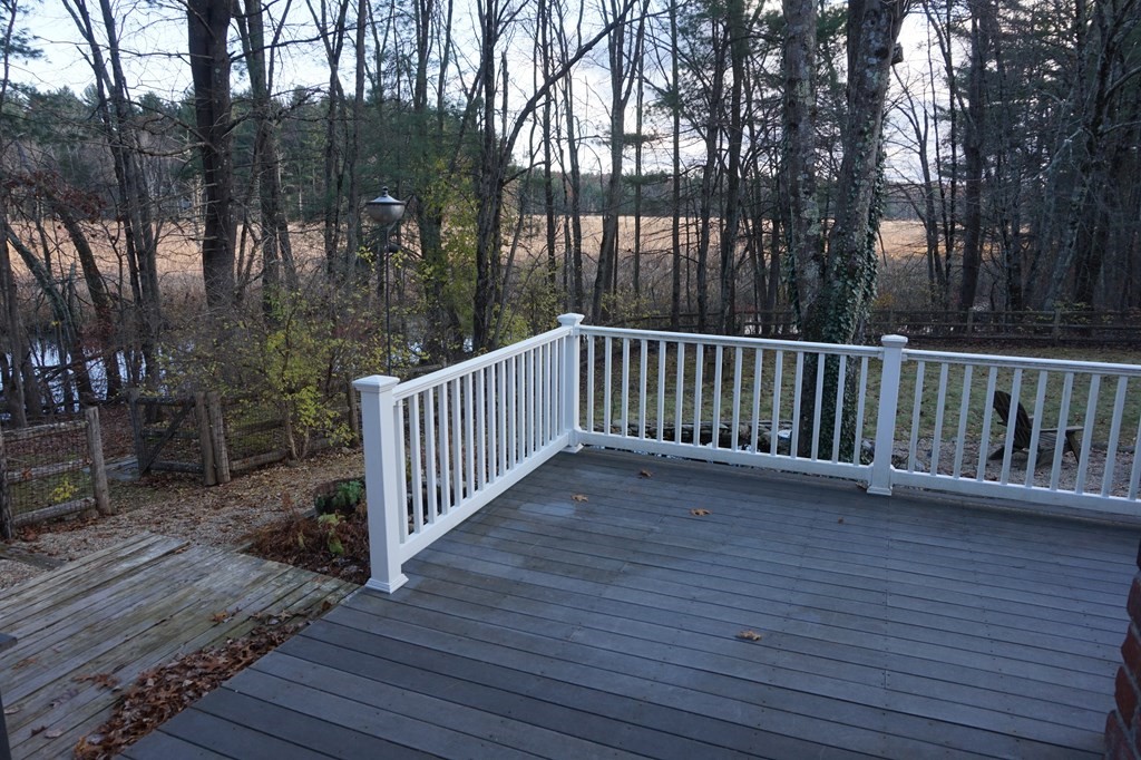 462 Lowell Road Groton, MA 01450 - Photo 26 of 42 a view of backyard with deck and outdoor seating