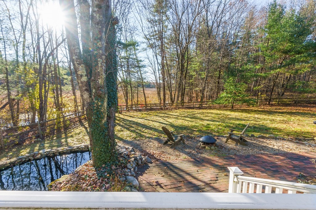 462 Lowell Road Groton, MA 01450 - Photo 28 of 42 a view of a yard with large trees