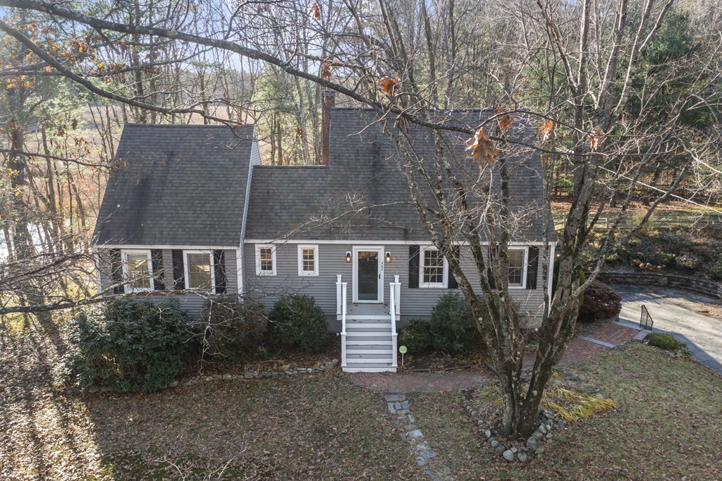 462 Lowell Road Groton, MA 01450 - Photo 3 of 42 a front view of a house with a yard