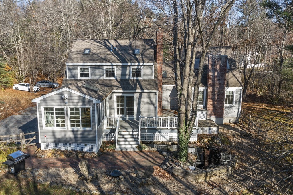 462 Lowell Road Groton, MA 01450 - Photo 33 of 42 a front view of a house with a garden
