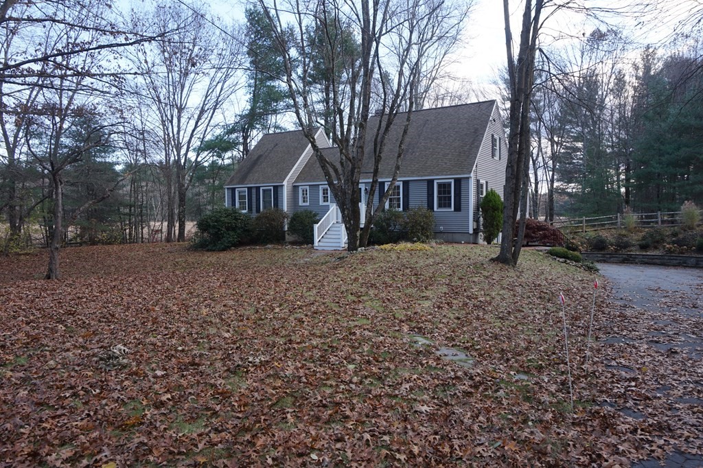 462 Lowell Road Groton, MA 01450 - Photo 41 of 42 a view of a house with a yard covered in snow