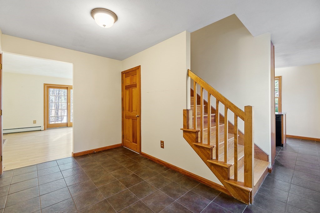 462 Lowell Road Groton, MA 01450 - Photo 5 of 42 a view of an entryway with wooden floor