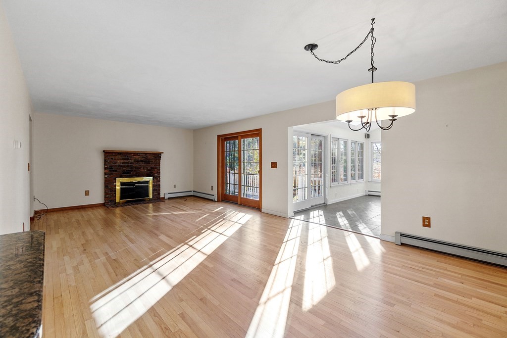 462 Lowell Road Groton, MA 01450 - Photo 10 of 42 a view of empty room with wooden floor
