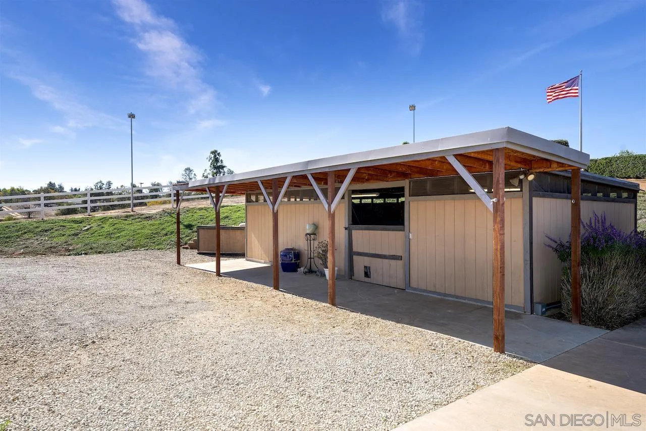 940 Heritage Ranch Road Ramona, CA 92065 - Photo 22 of 26 a view of a house with backyard and deck