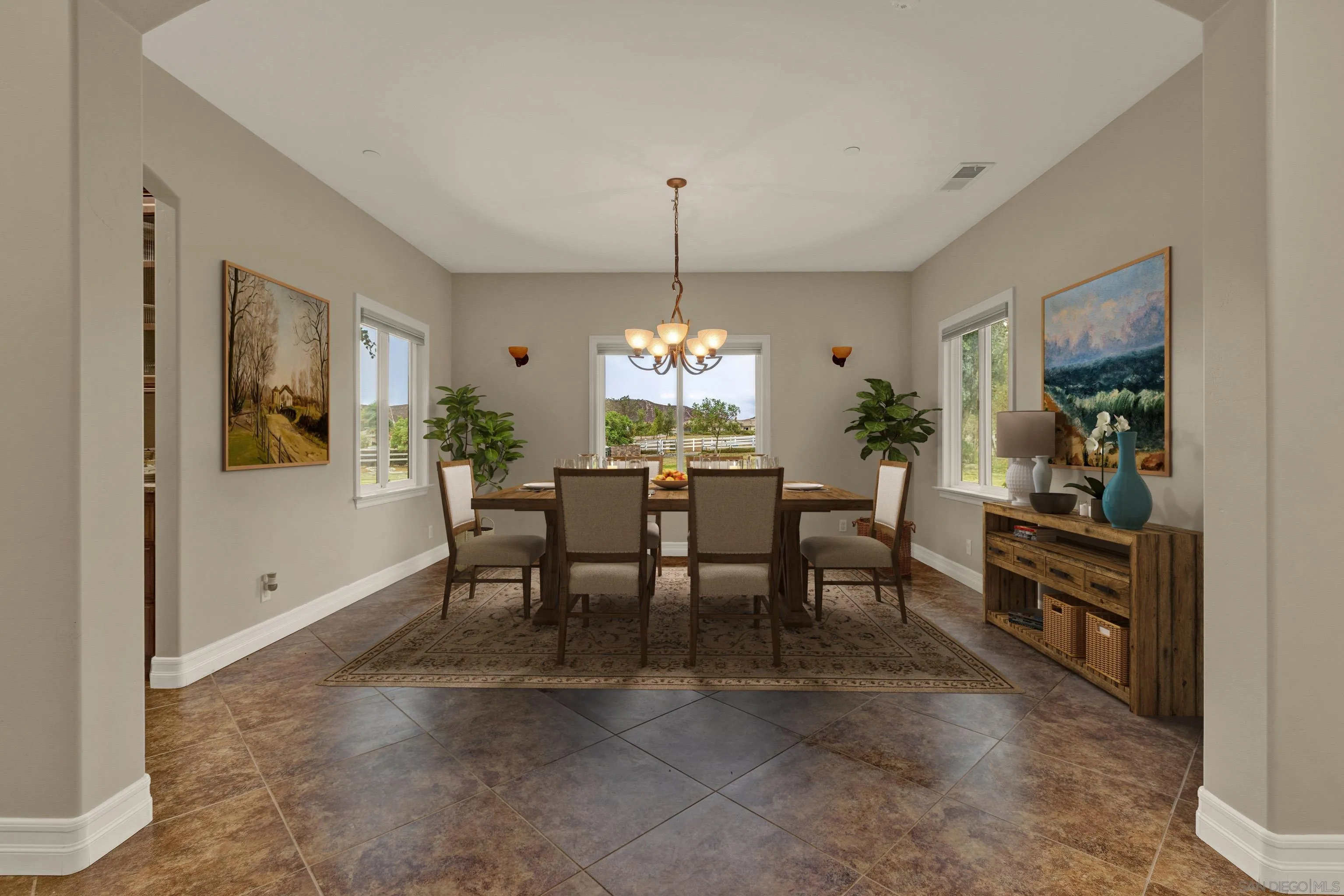 940 Heritage Ranch Road Ramona, CA 92065 - Photo 8 of 26 a view of a dining room with furniture and chandelier