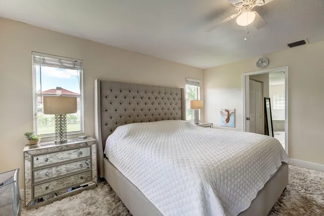 a kitchen with a refrigerator and a sink