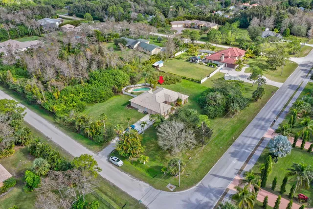 an aerial view of a golf course with parking space