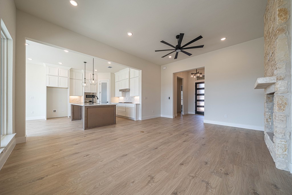 2013 Toscano Way Kerrville, TX 78028 - Photo 7 of 17 a view of a kitchen with a sink and a refrigerator