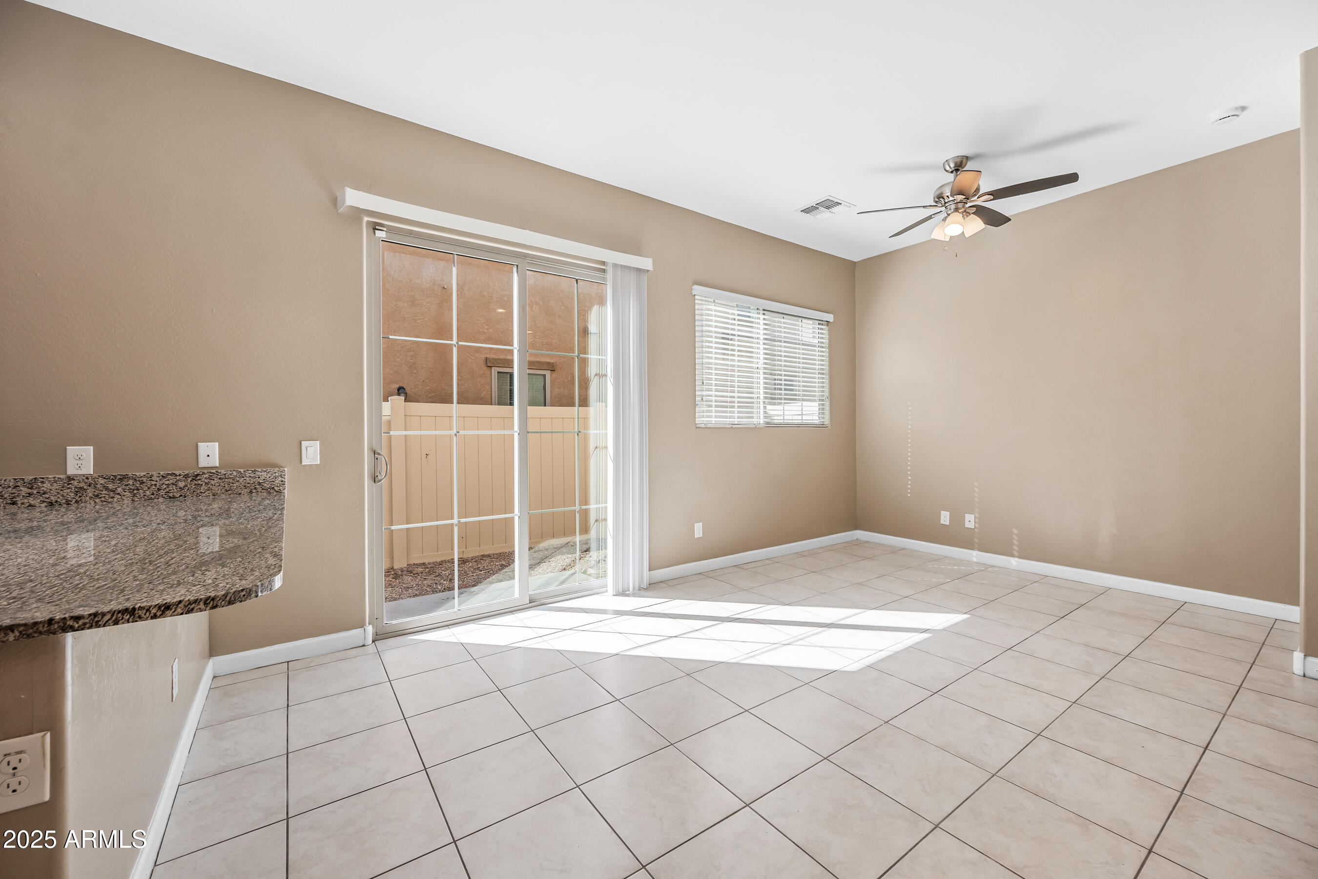 1367 South Country Club Drive, Unit 1131 Mesa, AZ 85210 - Photo 13 of 30 a view of an empty room with a window