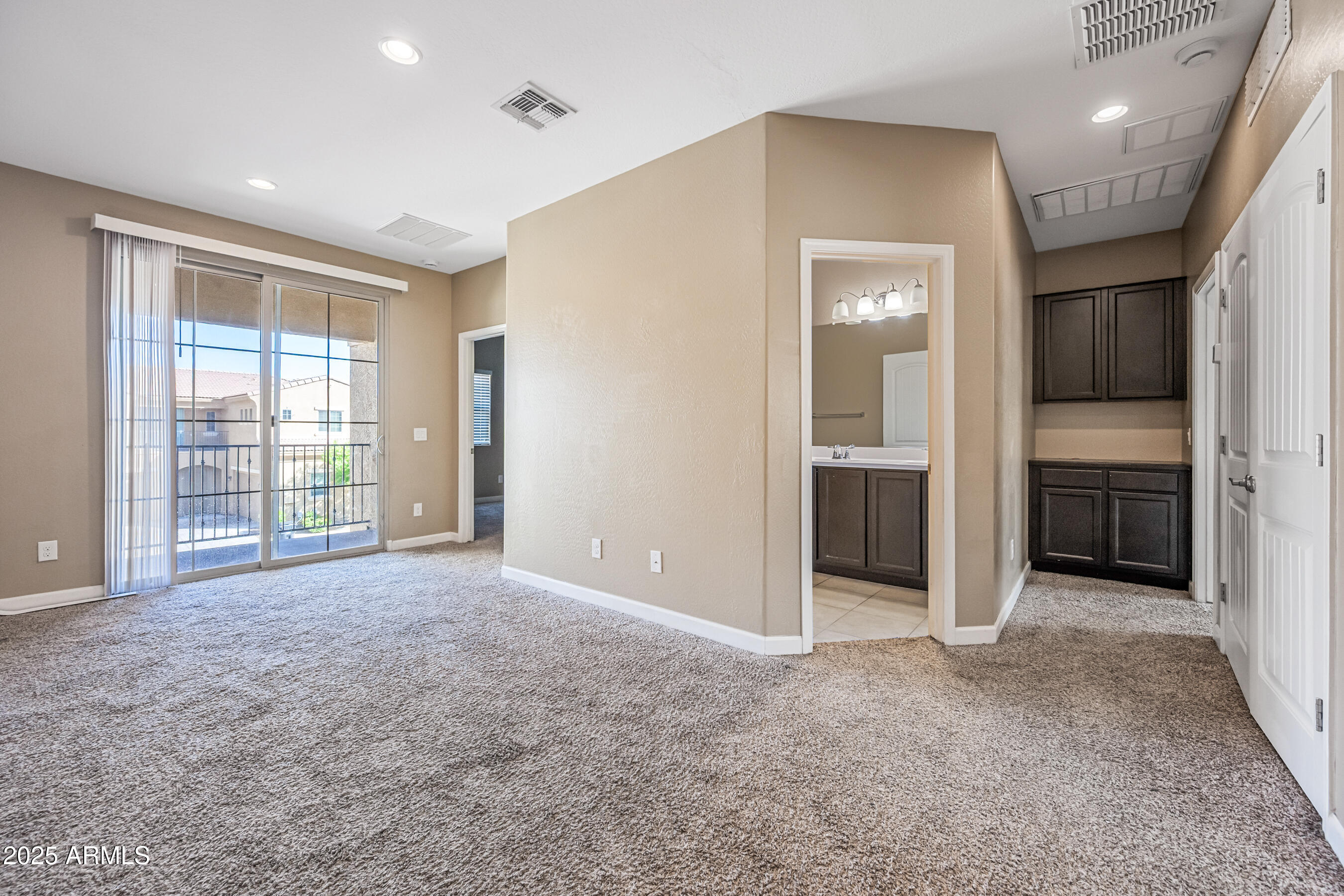 1367 South Country Club Drive, Unit 1131 Mesa, AZ 85210 - Photo 15 of 30 an empty room with windows and entrance