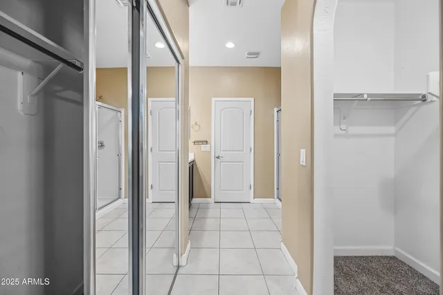 a bathroom with a glass shower door and a bathroom sink