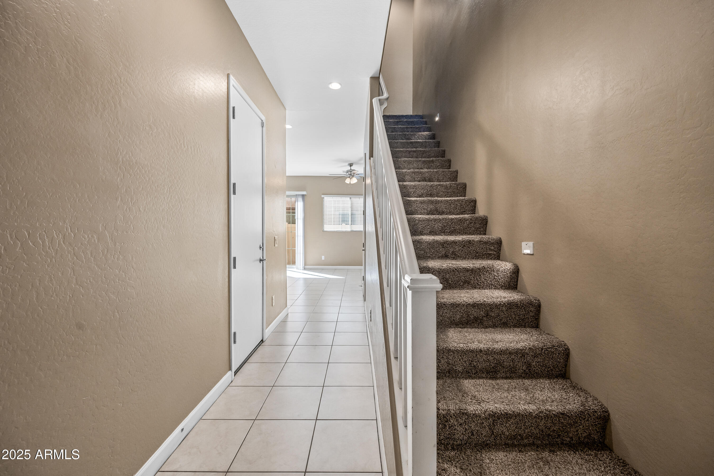 1367 South Country Club Drive, Unit 1131 Mesa, AZ 85210 - Photo 2 of 30 a view of a hallway with stairs and wooden floor