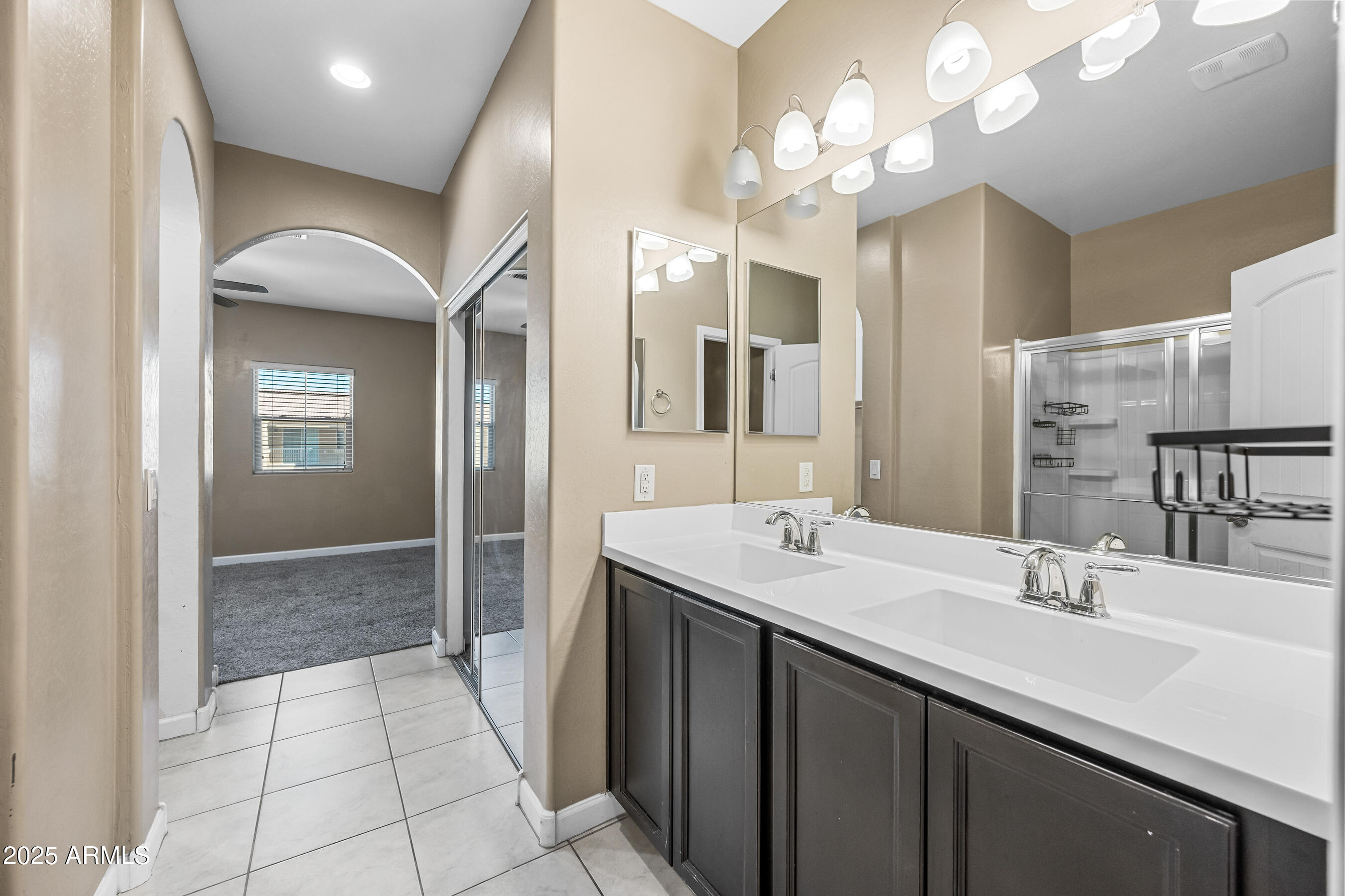 1367 South Country Club Drive, Unit 1131 Mesa, AZ 85210 - Photo 22 of 30 a bathroom with a sink double vanity and a mirror