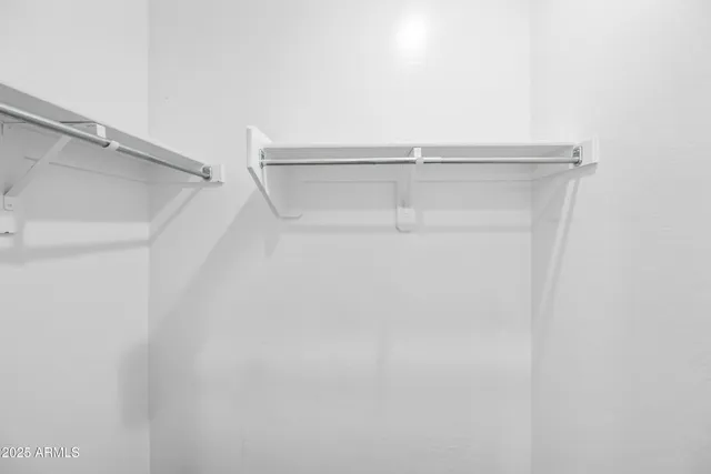 a view of an empty walk in closet