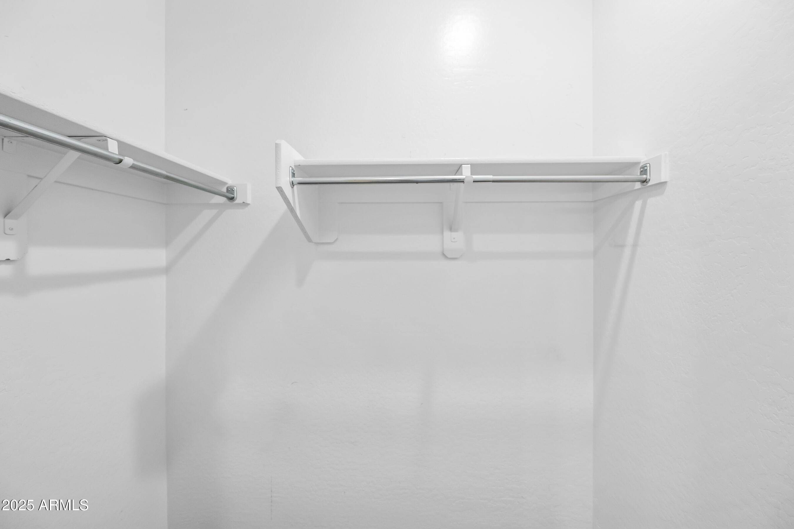 1367 South Country Club Drive, Unit 1131 Mesa, AZ 85210 - Photo 24 of 30 a view of an empty walk in closet