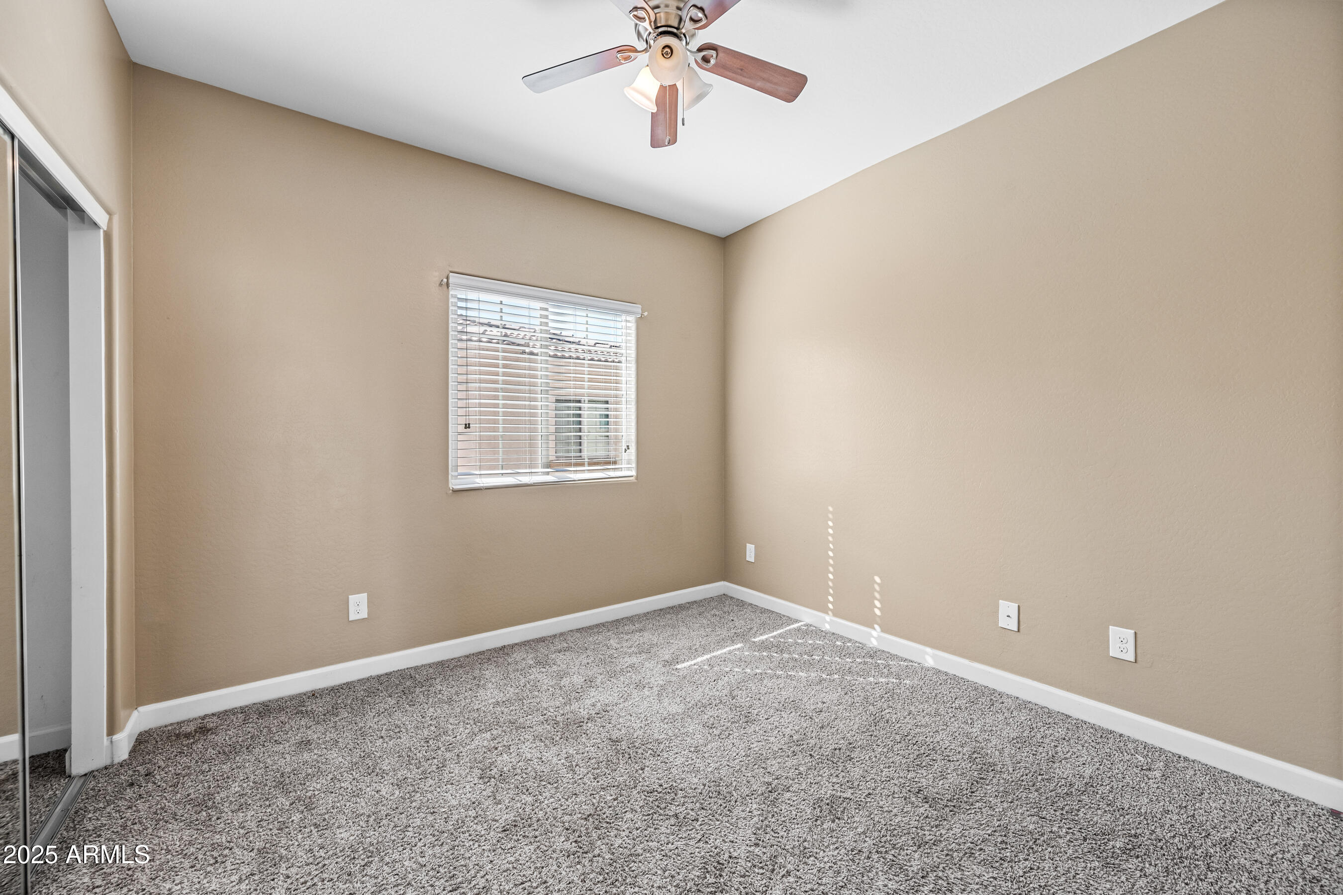 1367 South Country Club Drive, Unit 1131 Mesa, AZ 85210 - Photo 25 of 30 a view of an empty room with a window