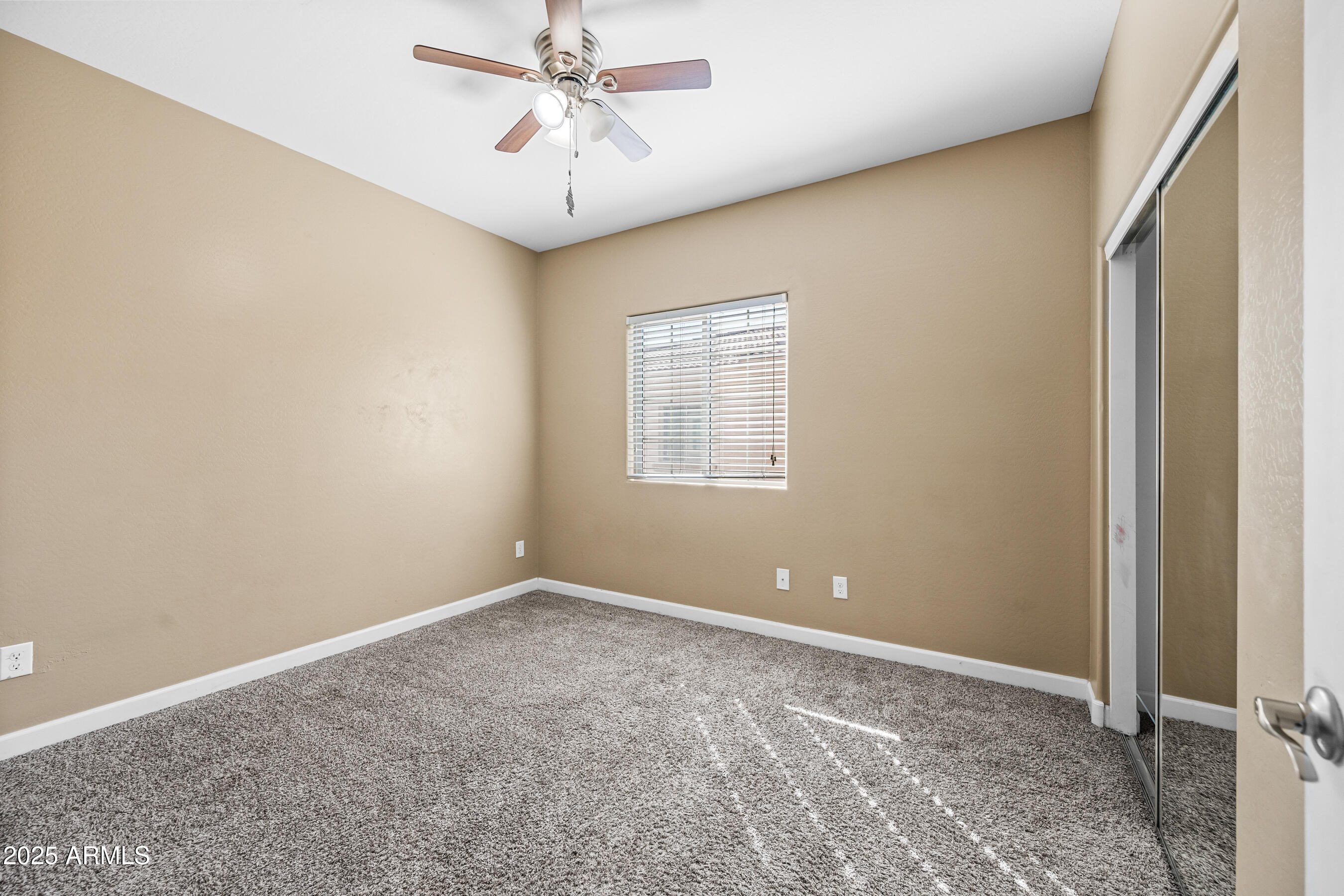 1367 South Country Club Drive, Unit 1131 Mesa, AZ 85210 - Photo 26 of 30 a view of room with window and ceiling fan