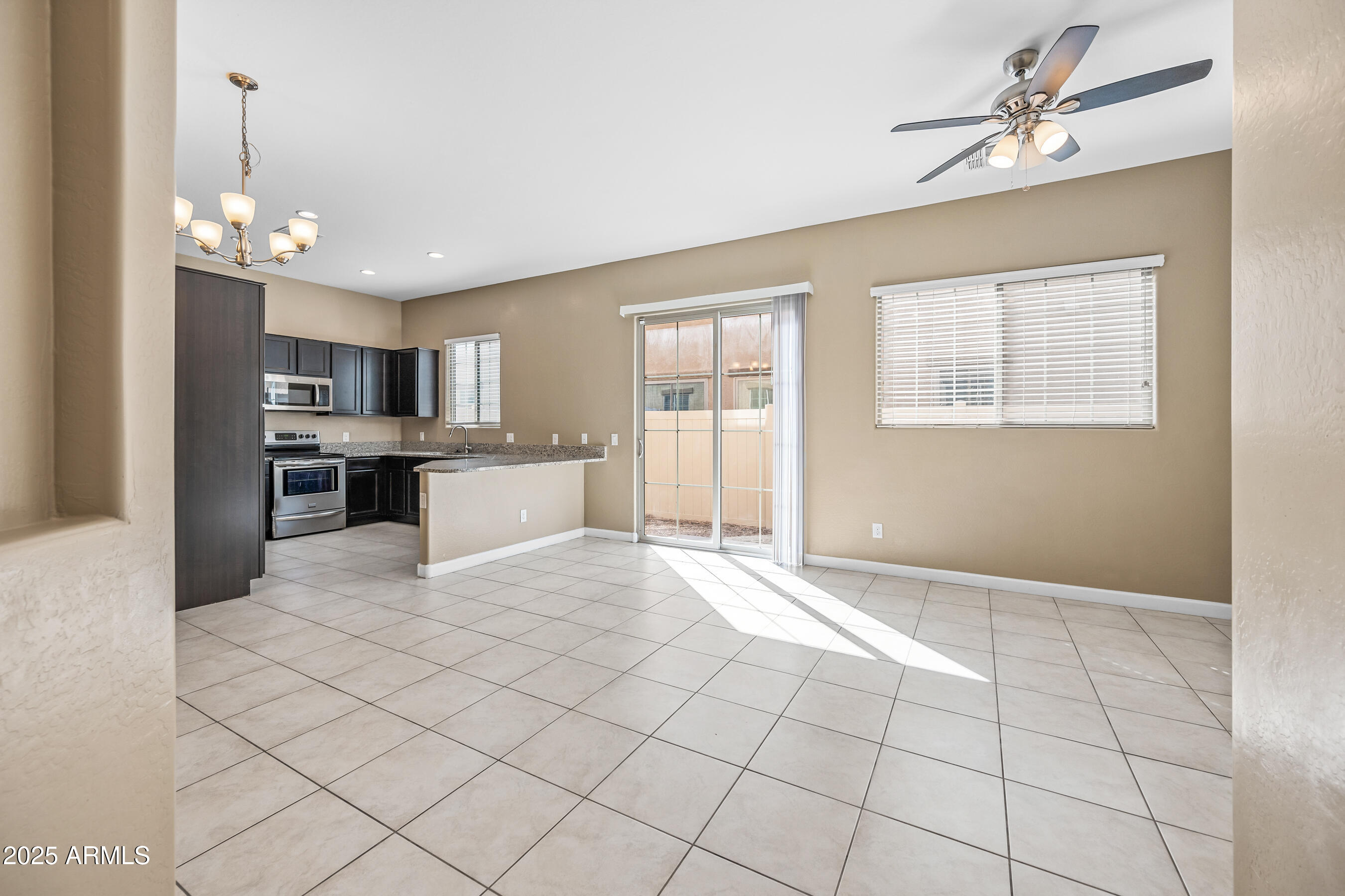 1367 South Country Club Drive, Unit 1131 Mesa, AZ 85210 - Photo 3 of 30 a view of a kitchen with a sink and cabinets
