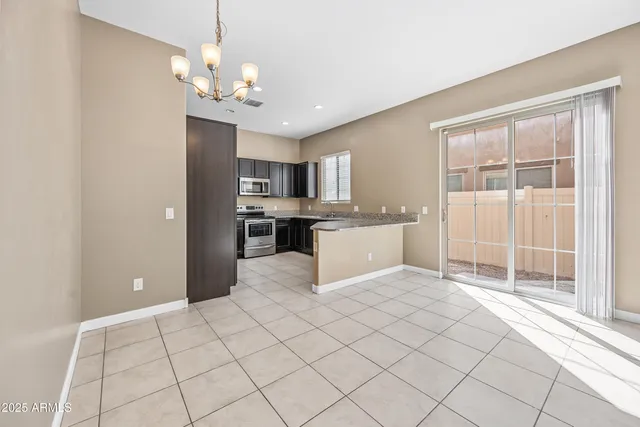 a view of a kitchen with microwave and cabinets