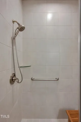 a view of a room with wooden floor and window