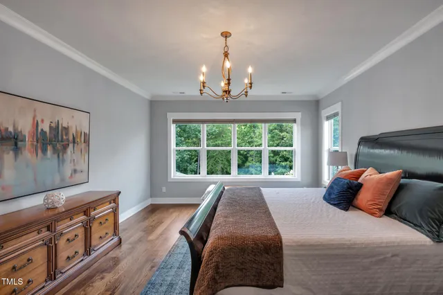 an empty room with wooden floor and a window