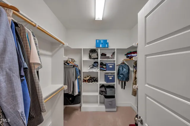 a view of a house with swimming pool and sitting area