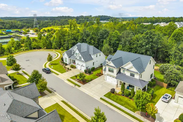 a view of two chairs in patio of the house