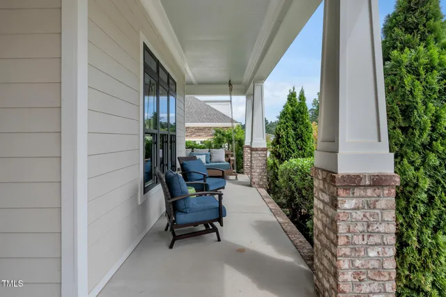 a view of a livingroom with furniture and a window
