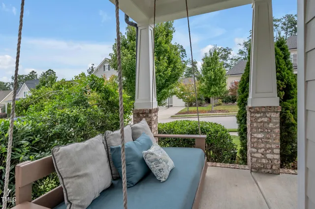 a view of wooden floor and windows in a room