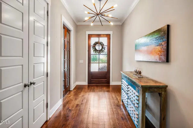 a living room with furniture a large window and a fireplace