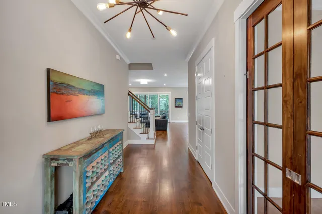 a living room with furniture a fireplace and a large window