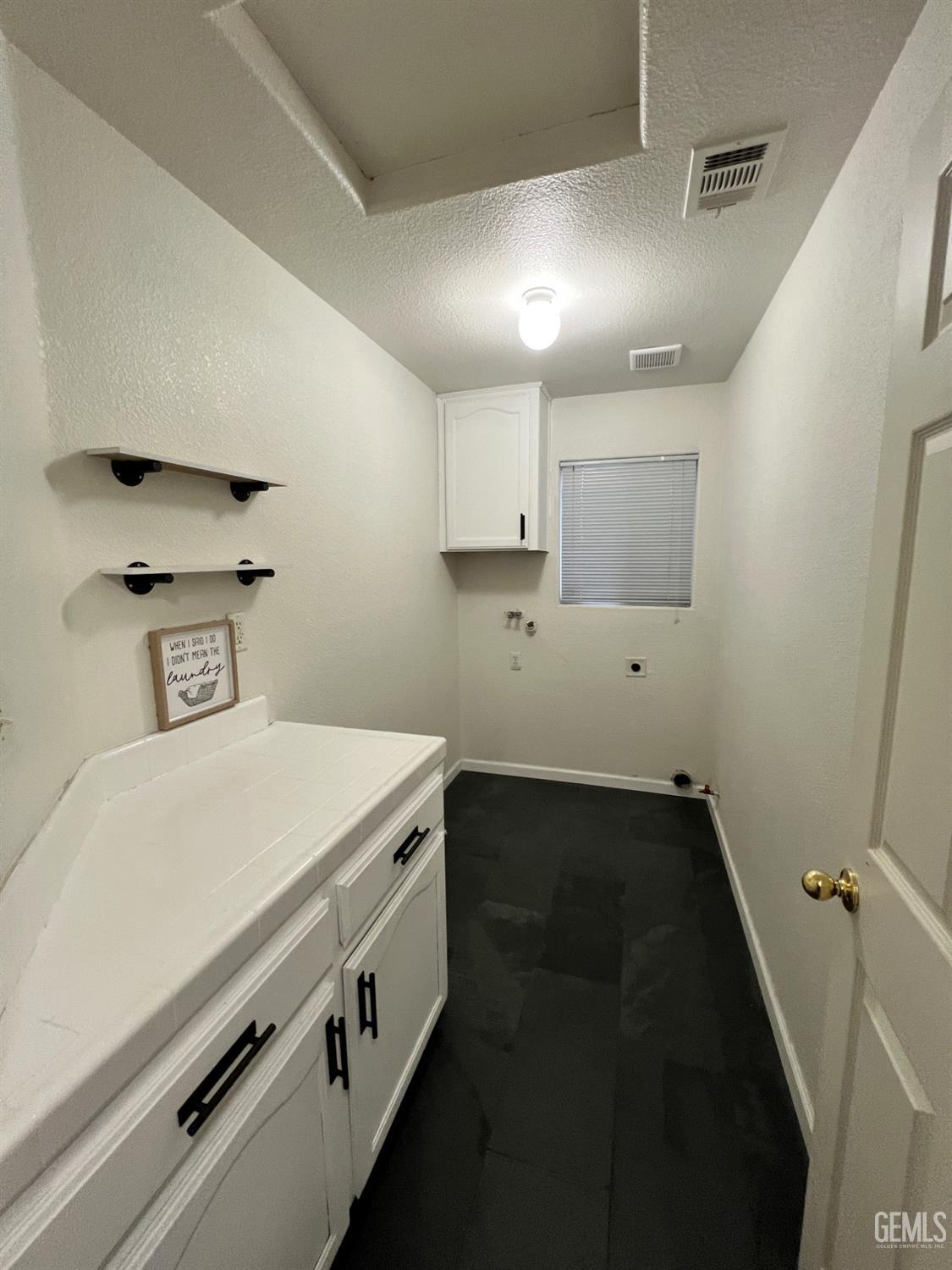 Undisclosed Address Wasco, CA 93280 - Photo 7 of 9 a kitchen with a stove and a refrigerator