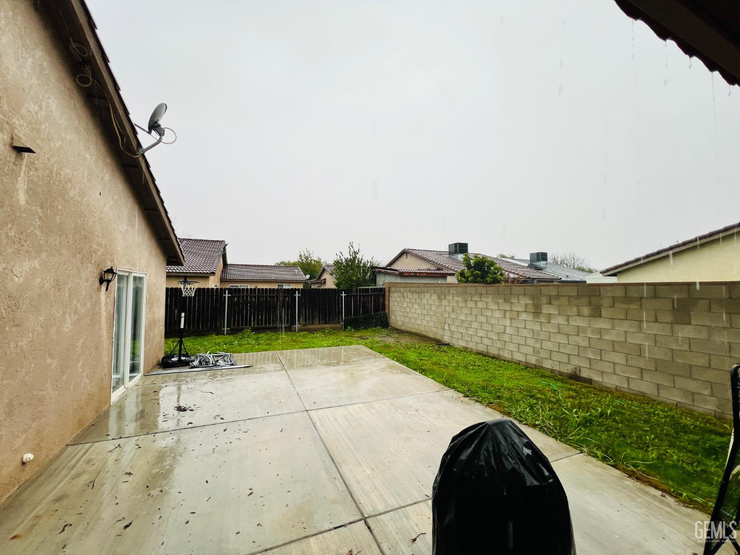 Undisclosed Address Wasco, CA 93280 - Photo 9 of 9 a view of a backyard with plants and lake view
