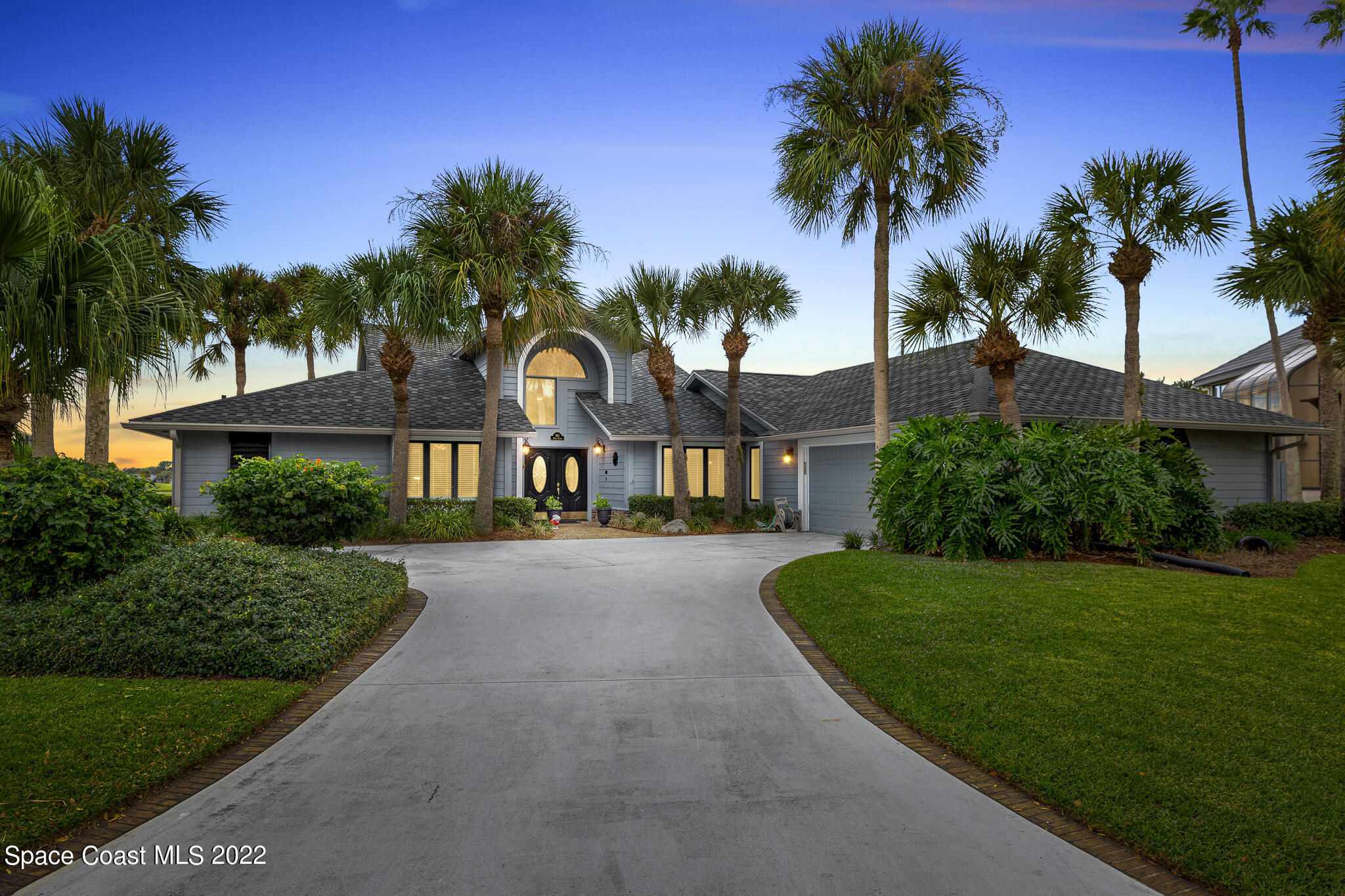 810 Kerry Downs Circle Melbourne, FL 32940 - Photo 1 of 59 a front view of a house with a garden and a yard
