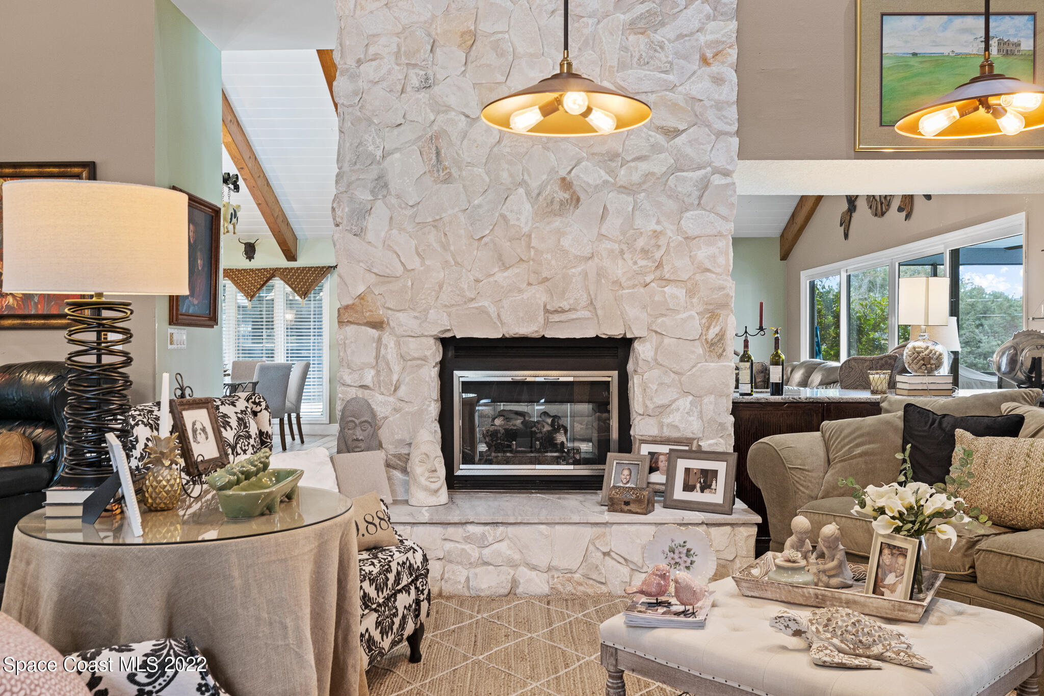 810 Kerry Downs Circle Melbourne, FL 32940 - Photo 12 of 59 a living room with furniture fireplace and a fireplace