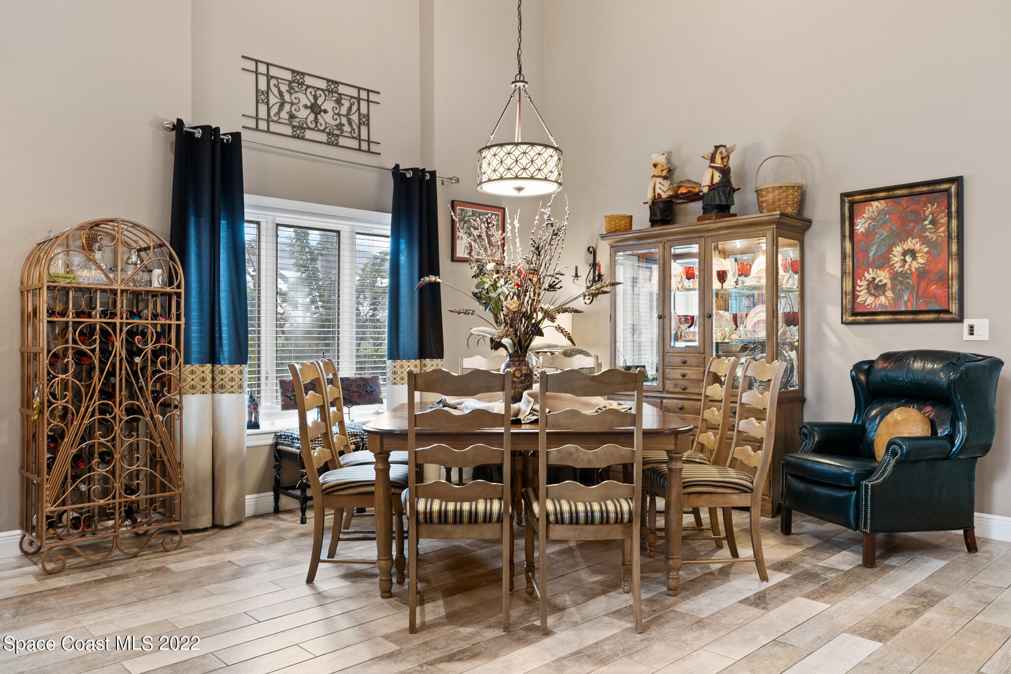 810 Kerry Downs Circle Melbourne, FL 32940 - Photo 14 of 59 a view of a dining room with furniture and chandelier