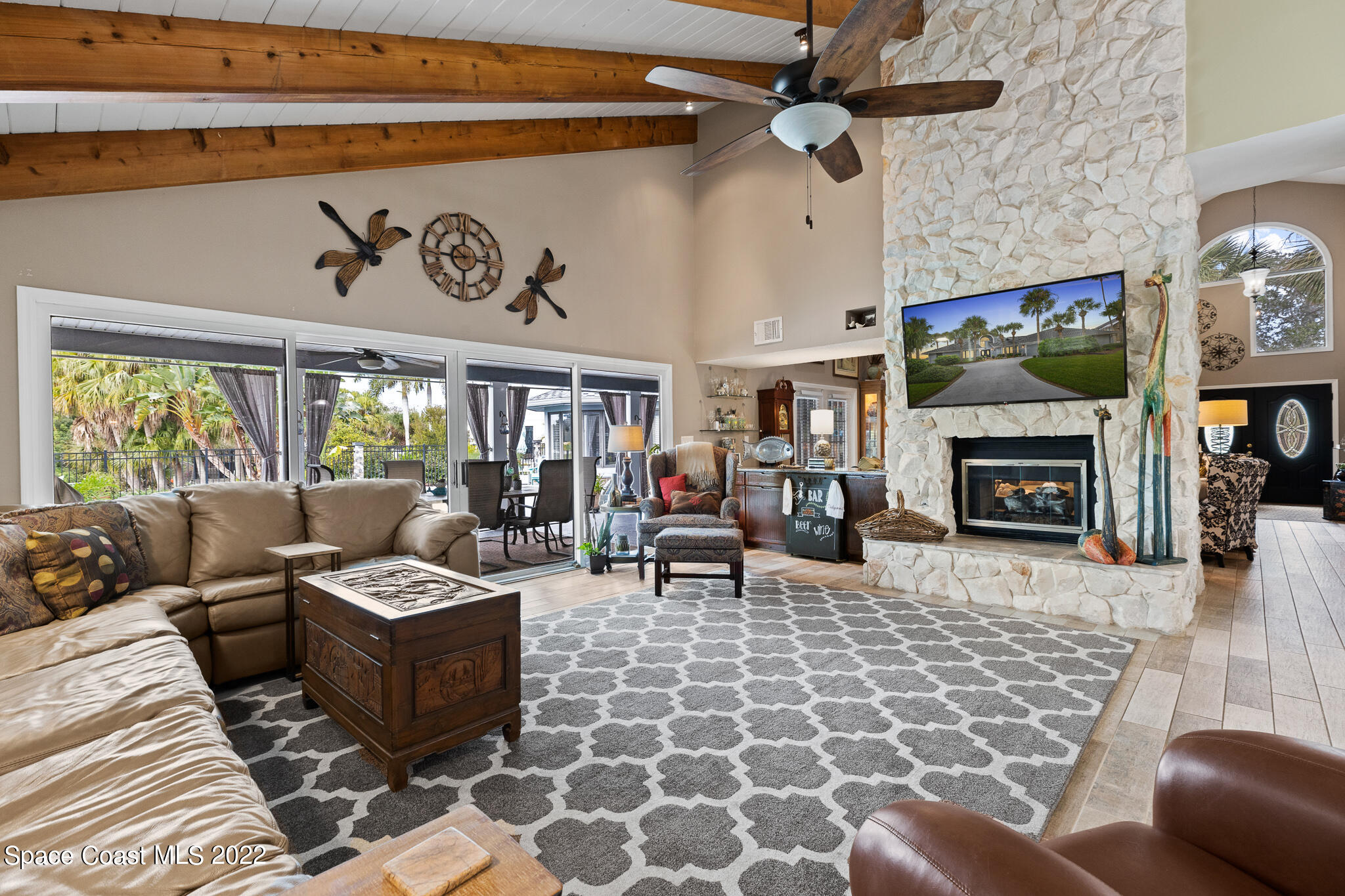 810 Kerry Downs Circle Melbourne, FL 32940 - Photo 16 of 59 a living room with furniture and a fireplace