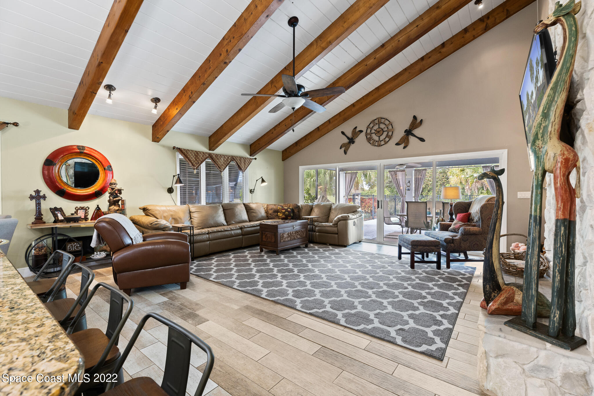810 Kerry Downs Circle Melbourne, FL 32940 - Photo 27 of 59 a living room with lots of furniture and a large window