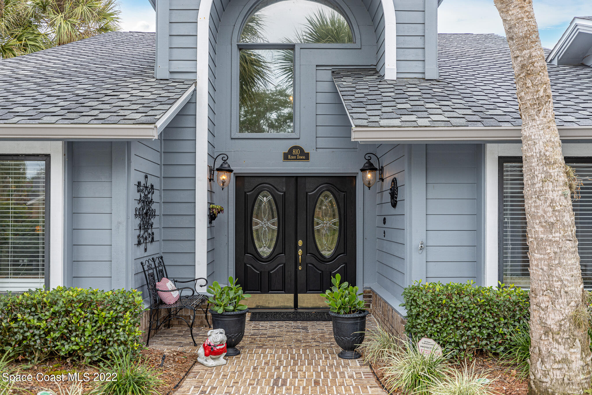 810 Kerry Downs Circle Melbourne, FL 32940 - Photo 3 of 59 a front view of a house with garden