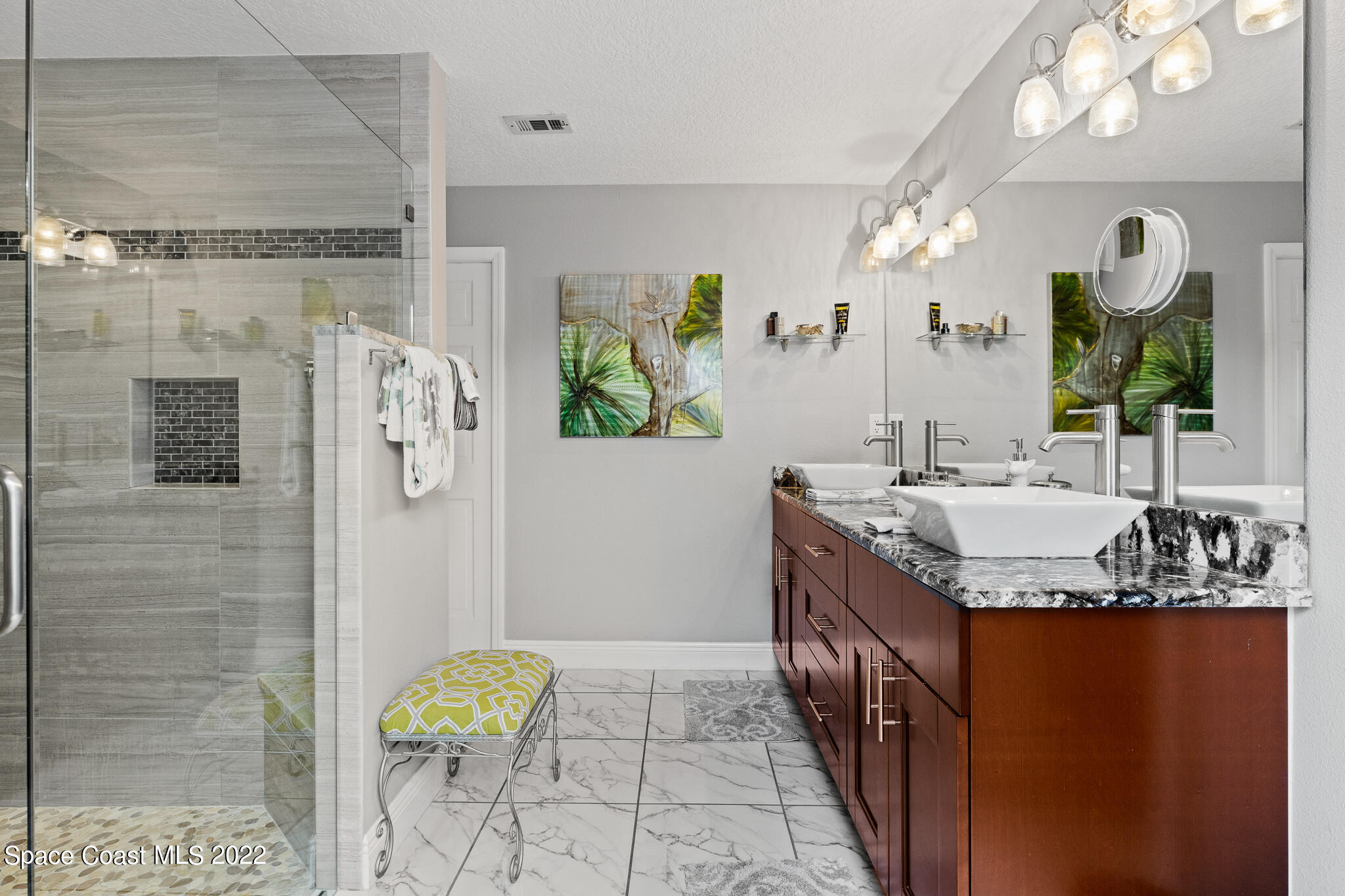 810 Kerry Downs Circle Melbourne, FL 32940 - Photo 33 of 59 a bathroom with a granite countertop shower a sink and a mirror