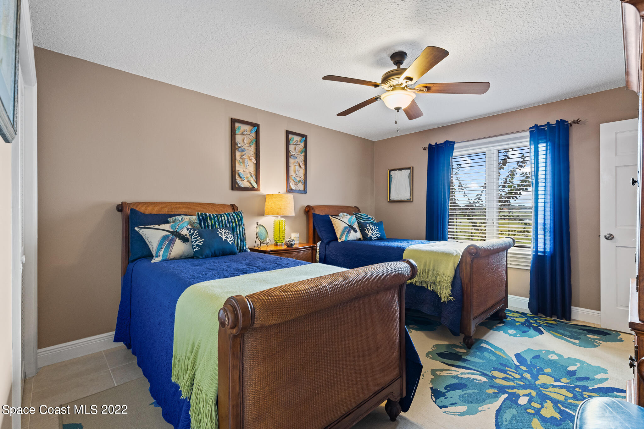 810 Kerry Downs Circle Melbourne, FL 32940 - Photo 39 of 59 a living room with furniture ceiling fan and a window