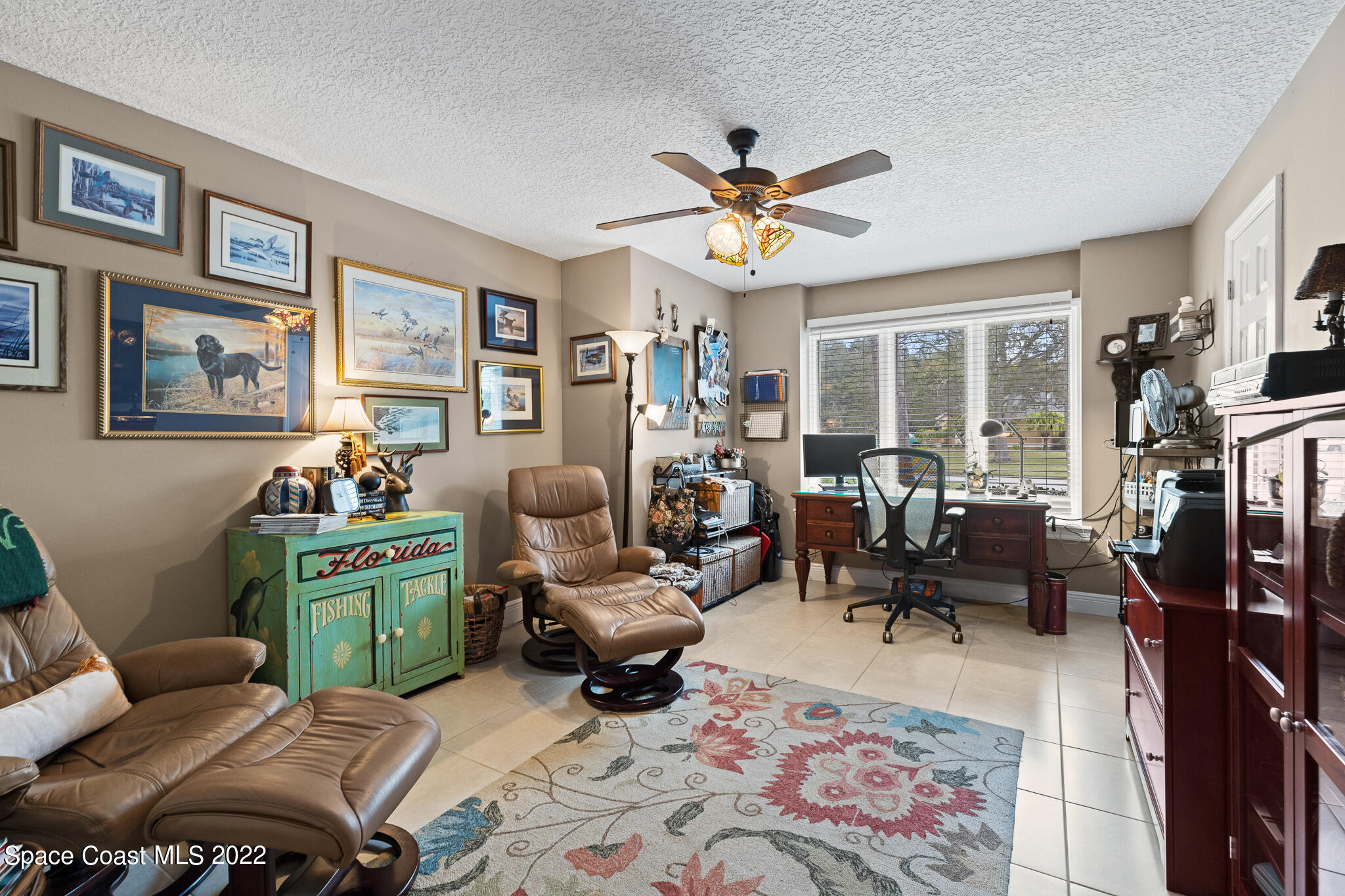 810 Kerry Downs Circle Melbourne, FL 32940 - Photo 41 of 59 a living room with furniture fireplace and a window