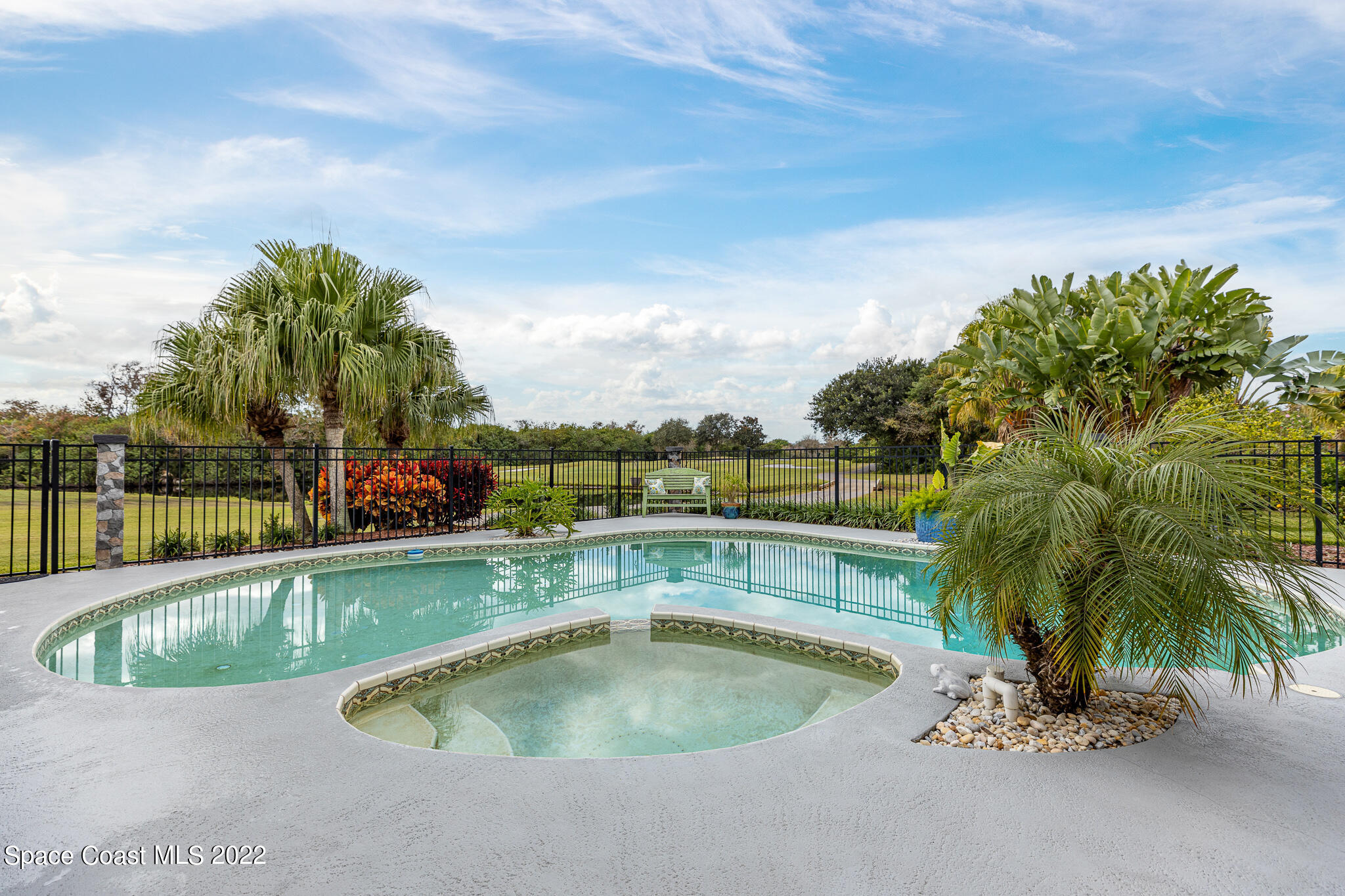810 Kerry Downs Circle Melbourne, FL 32940 - Photo 48 of 59 a view of a swimming pool and a chair