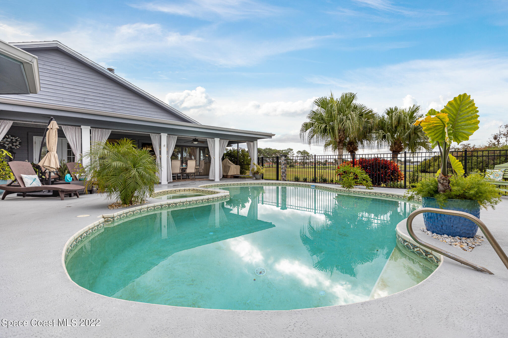 810 Kerry Downs Circle Melbourne, FL 32940 - Photo 49 of 59 a view of a swimming pool with sitting area